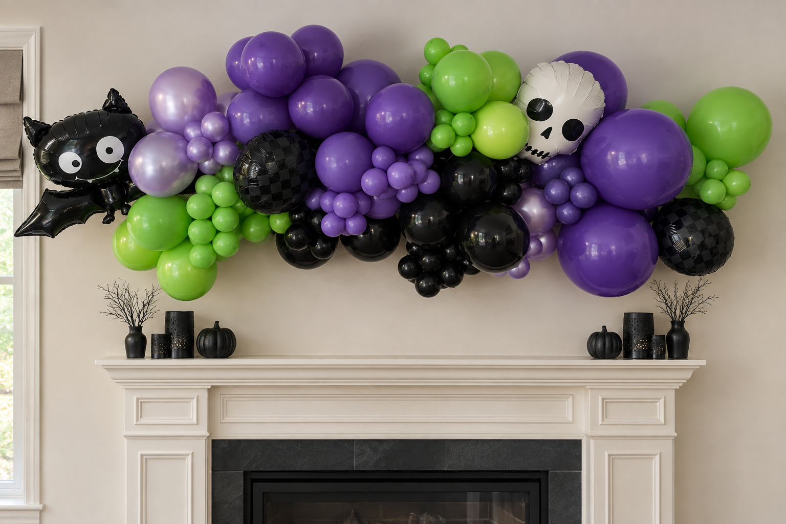 Purple, green and black Halloween balloon garland with a skull and bat above a fireplace